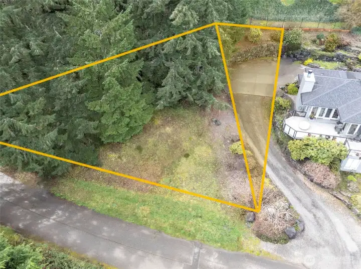 Triangular area nearest the house is the approximate portion of the vacant lot that will be removed through BLA prior to closing.   Lines are approximated, buyer to verify to own satisfaction.