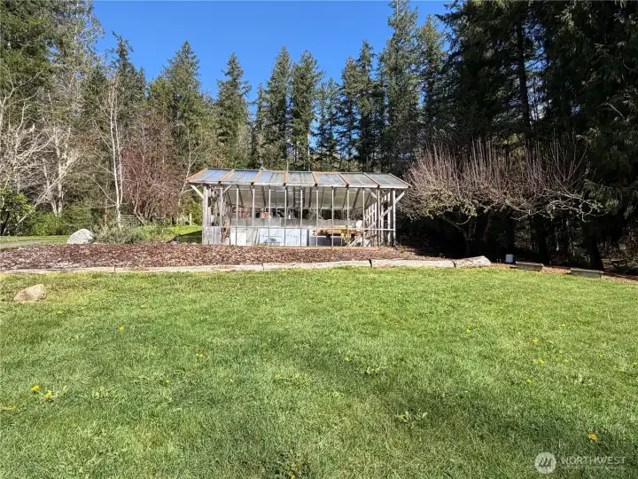 South facing greenhouse just waiting for your flowers and veggies.