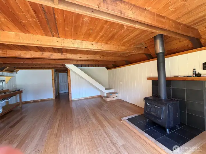 Open space with loft above.