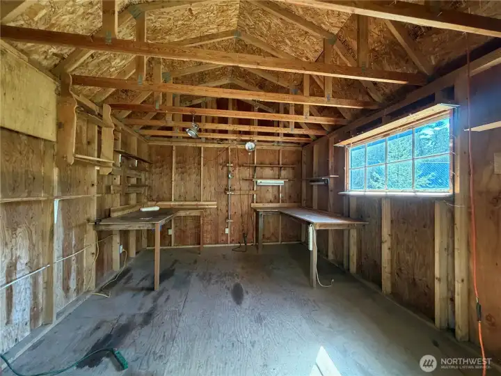 Second outbuilding used as woodworking area.