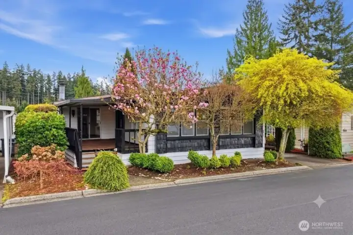 Front of home with mature landscaping Front of home with mature landscaping