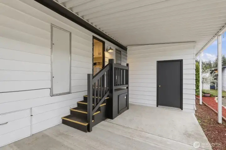 extra storage in the secure room at the back of the carport