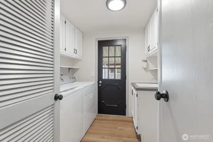 Laundry room with access to the carport