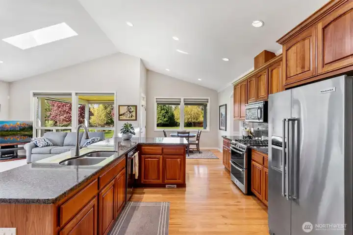 Bright Cheery Kitchen with Granite and Stainless