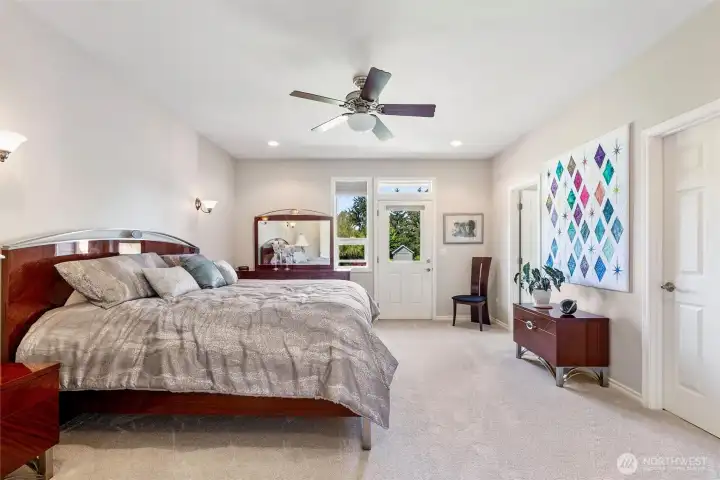 Primary Bedroom is Spacious with a Door Leading to the Beautiful Backyard