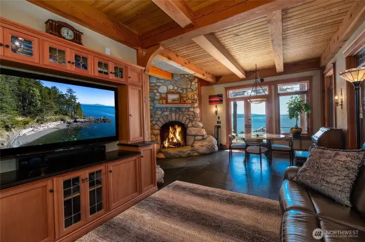 Media room looking onto social nook looks to outer deck
