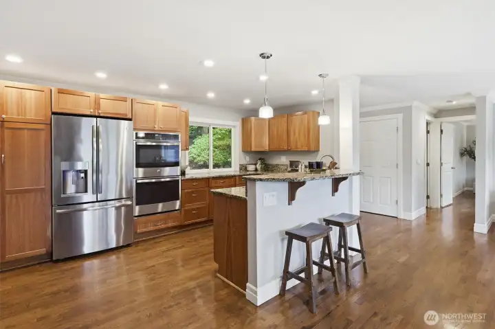 Open kitchen with updated appliances.
