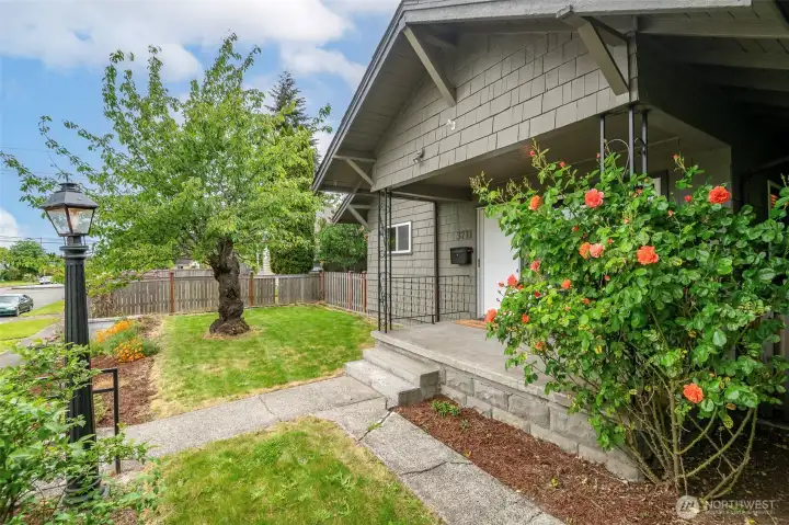 Paved path to porch also connects to the backyard