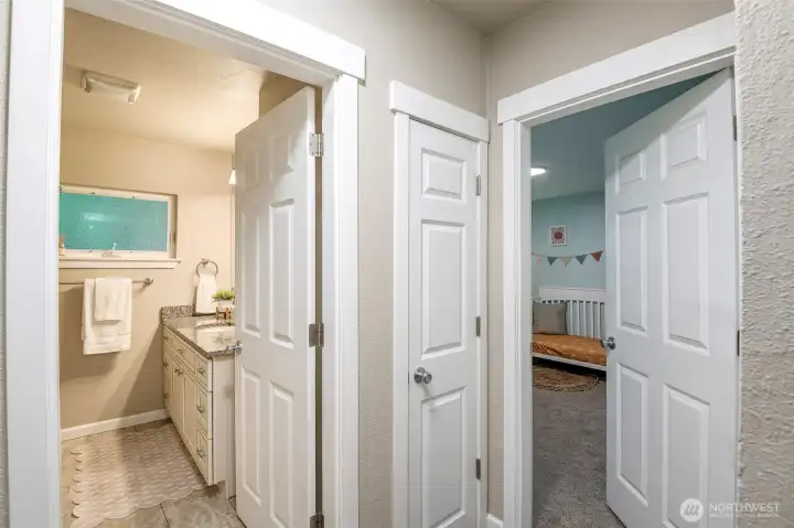 Centrally located bathroom separates the bedrooms along with furnace closet.