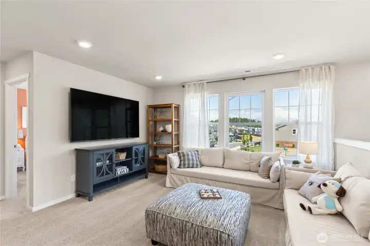 This home has 4 bedrooms on the upper level with this loft space which can be used for home theater or game room. Pictures are for representation only colors and options will vary.