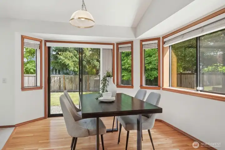 Dining area off of the kitchen with access to the back yard and patio