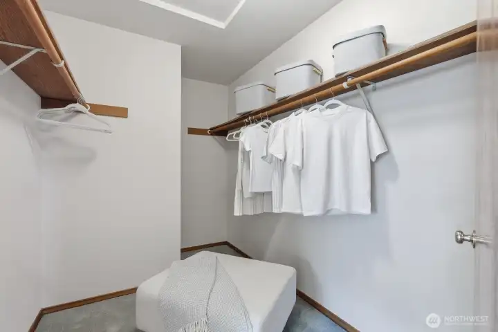 Primary bedroom walk-in closet