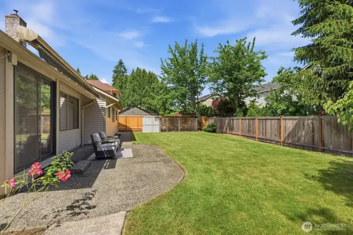 Lots of options in this yard, notice the dog run and storage shed