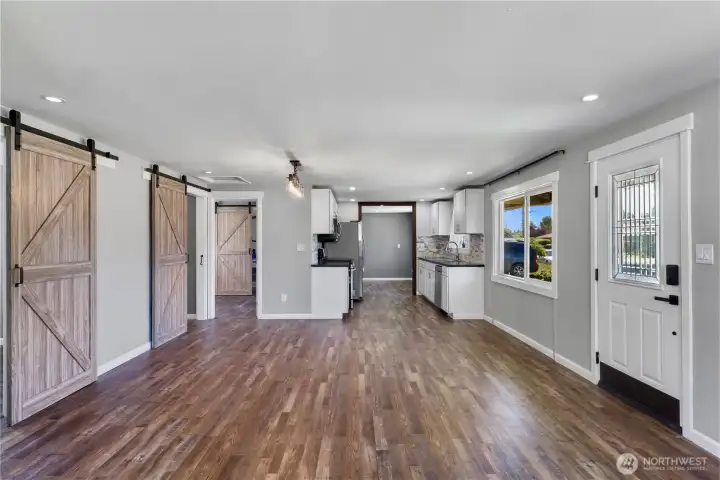 Home features barn door accents to each room giving the space function and design