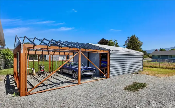 Large and open backyard with additional outbuildings for storage and hobbies!