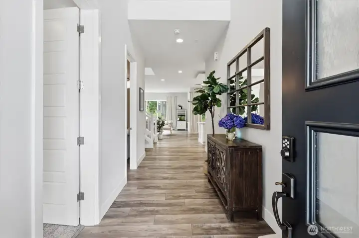 Large open entryway with vaulted ceilings. There is a main floor bedroom with private bathroom here to the left. Large open entryway with vaulted ceilings. There is a main floor bedroom with private bathroom here to the left.