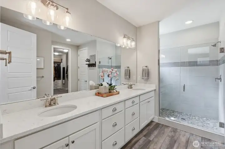Primary bathroom. Huge walk in closet has custom built in shelving. Primary bathroom. Huge walk in closet has custom built in shelving.