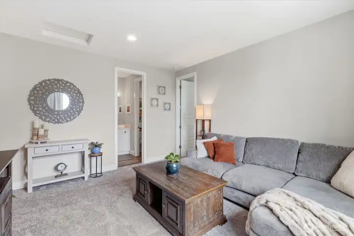 Living room, lift, bonus room. Whatever you need it to be! This living room is tucked back on the upper level, creating a private space for multigenerational living. Living room, lift, bonus room. Whatever you need it to be! This living room is tucked back on the upper level, creating a private space for multigenerational living.