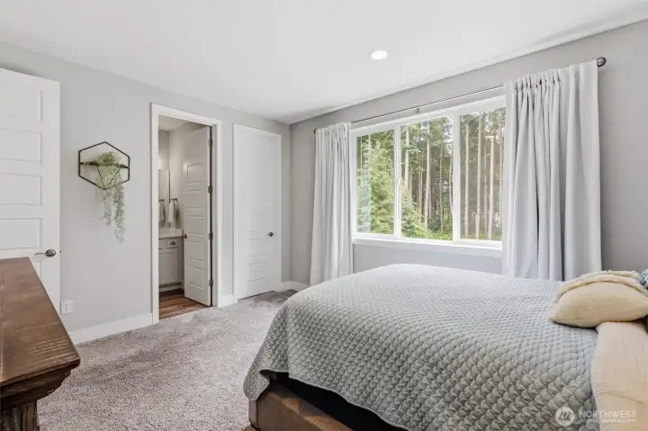 4th bedroom upstairs, stunning view out to the trees and private backyard. Walk in closet and access into the bathroom. 4th bedroom upstairs, stunning view out to the trees and private backyard. Walk in closet and access into the bathroom.