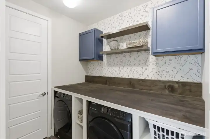 Custom built out utility laundry room, makes doing the every day tasks simple! Custom built out utility laundry room, makes doing the every day tasks simple!