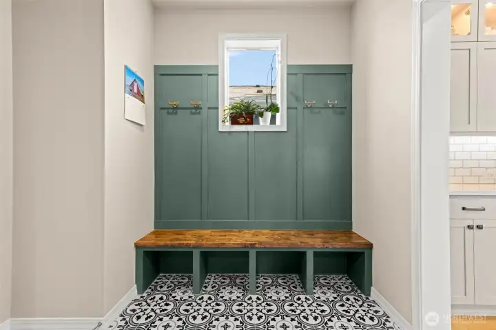 mudroom area with fun tile