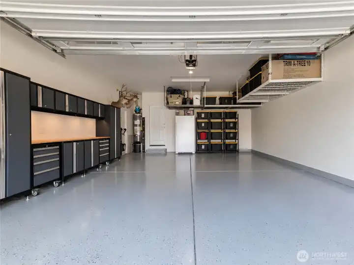 Oversized 2 car garage with plenty of storage and work space