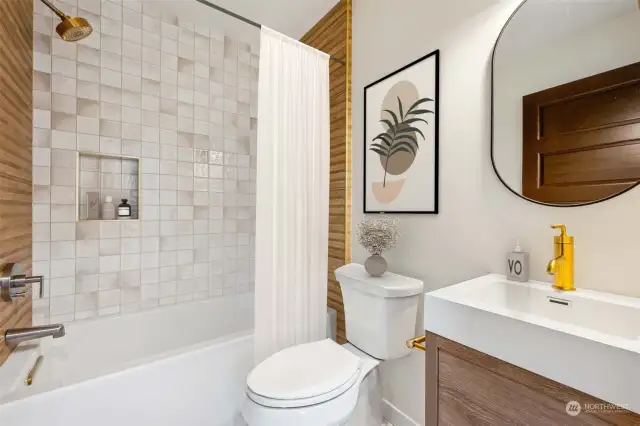 Bright and cheery full bath with built-in shower niche for your extra tall shampoo bottles.  Yes! Everything is brand spanking new.  Notice the extra quiet and high-end bath fan/light when you tour in person.