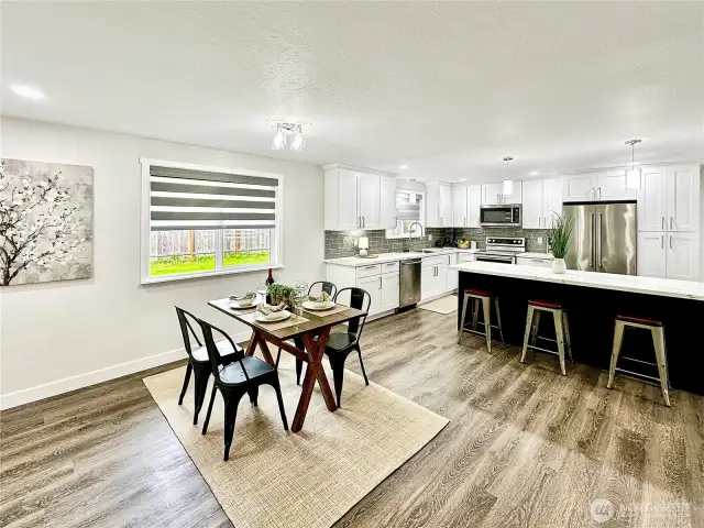 Ample dining area.  Luxury remote control blinds throughout home.