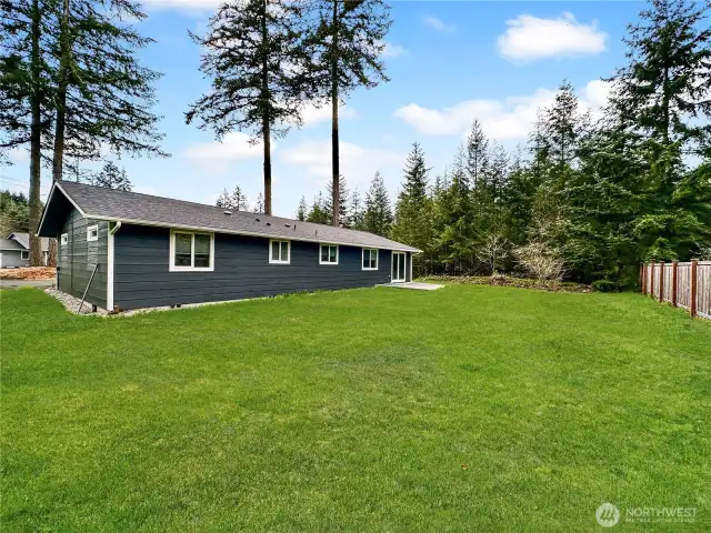 Rear view of home, sitting on just over a third of an acre.