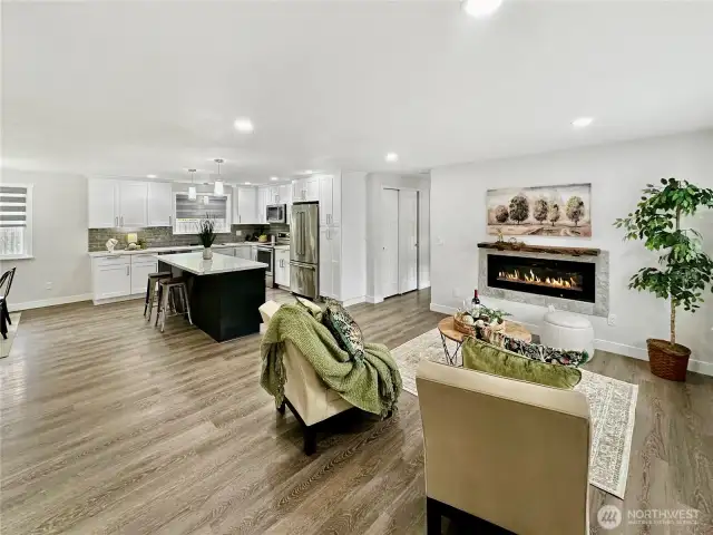 Welcome!  Entry off living room, stunning electric fireplace to keep things cozy.  Gorgeous open kitchen.