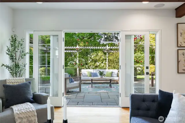 French doors lead to the outdoor patio with gas BBS line and plenty of room to entertain and play