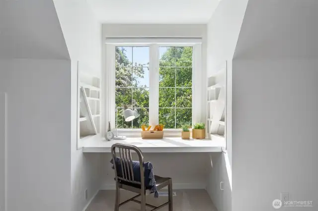 Spacious upstairs bonus/recreation room with skylight and built ins. Located above the garage.