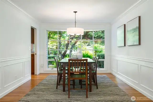 Formal dining room adjacent to the living room and kitchen