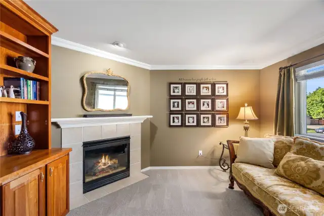 The sitting room is part of the primary suite and offers an inviting space to read, relax or just cuddle up!