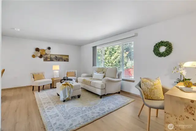 Open concept living room w/lots of light.