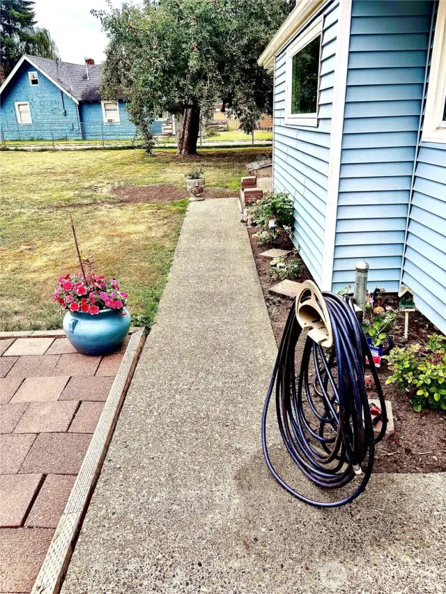 backyard patio and view of apple trees