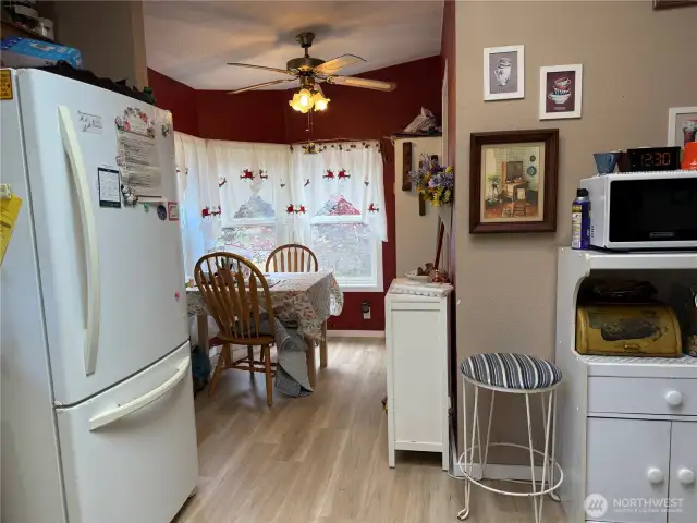 Breakfast nook off kitchen and laundry room to the right