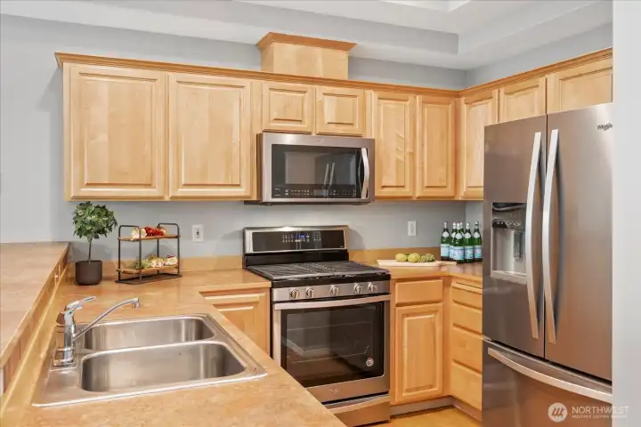 Newer stainless appliances including gas stove are all in pristine condition.