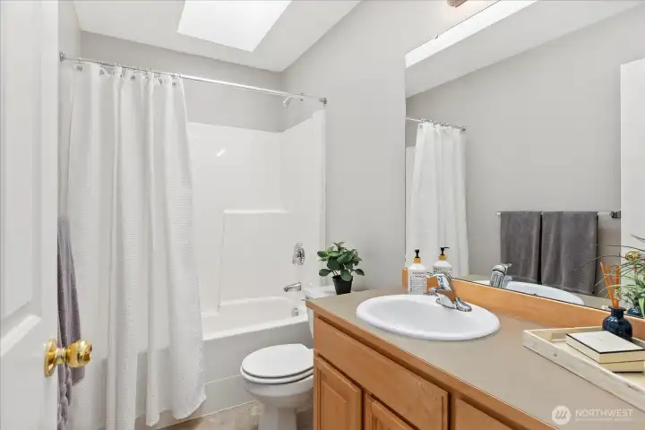 Hall Bath - skylight and easy care acrylic tub surround.