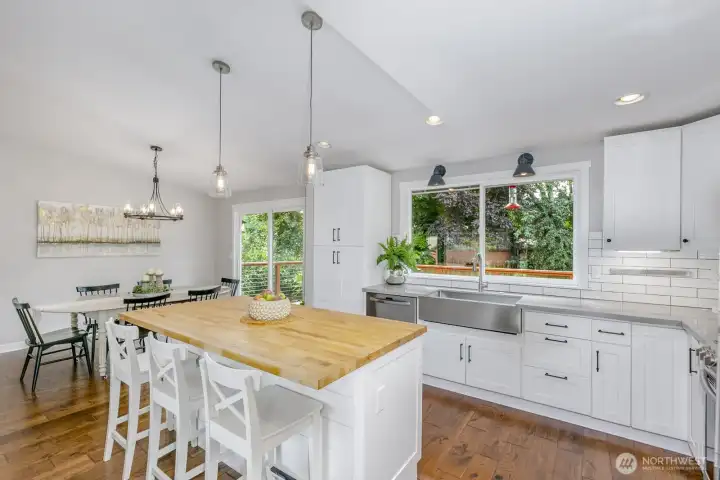 gorgeous kitchen with quartz counters and butcherblock island