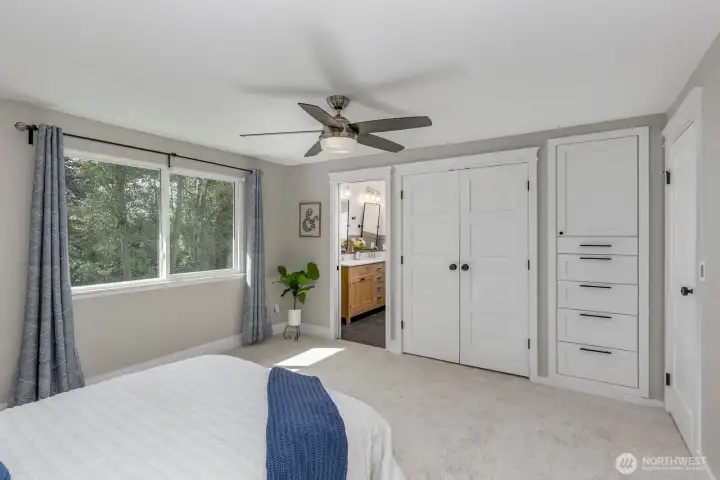 Primary bedroom with closet and built in drawers