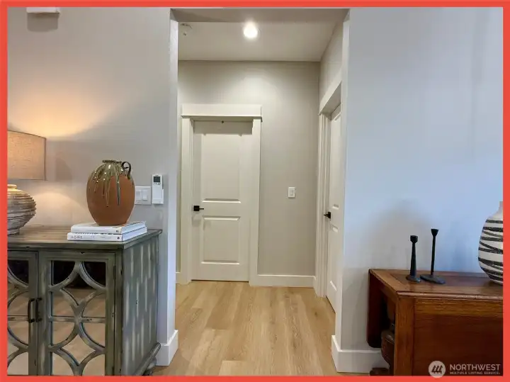 Follow a separate hallway to a full bathroom and 2 additional bedrooms
