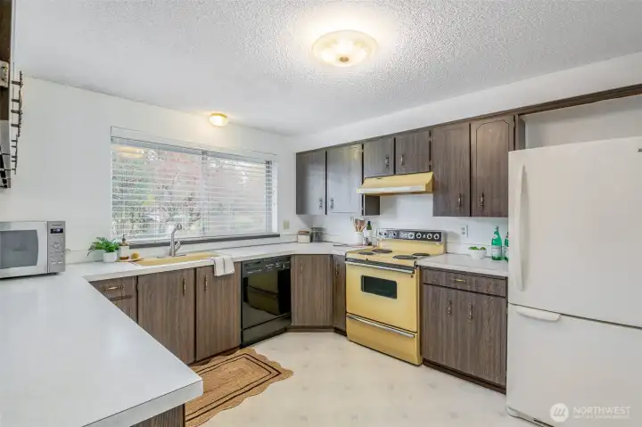 This well-maintained kitchen is bright and clean and ready for your culinary adventures!