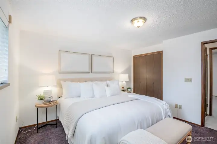 This generous sized primary bedroom has two full closets