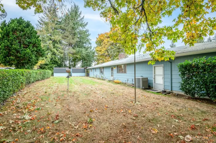 This lovingly maintained yard is complete with sprinklers