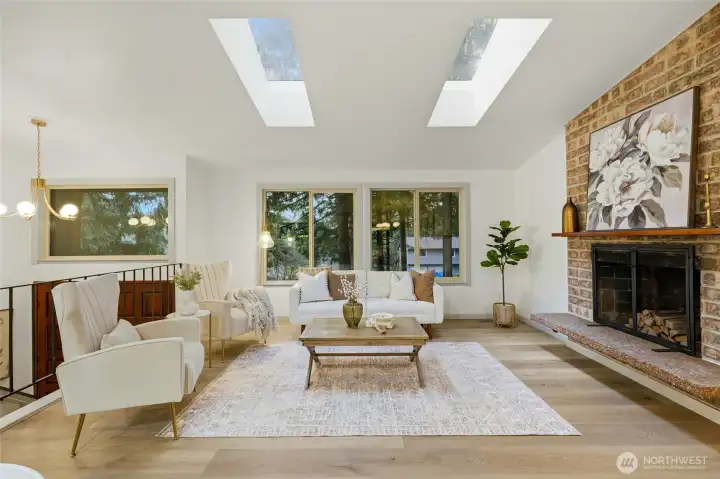 Bright and welcoming living room with custom lighting in the entry
