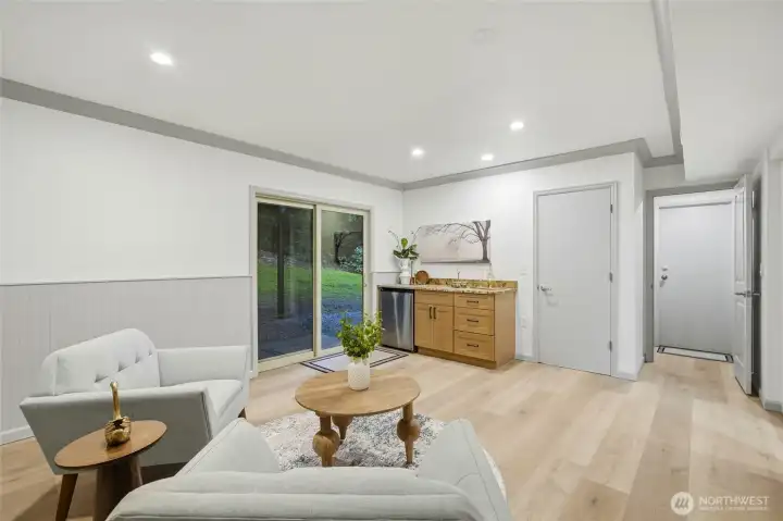 Comfortable Family Room with slider door leading into the backyard