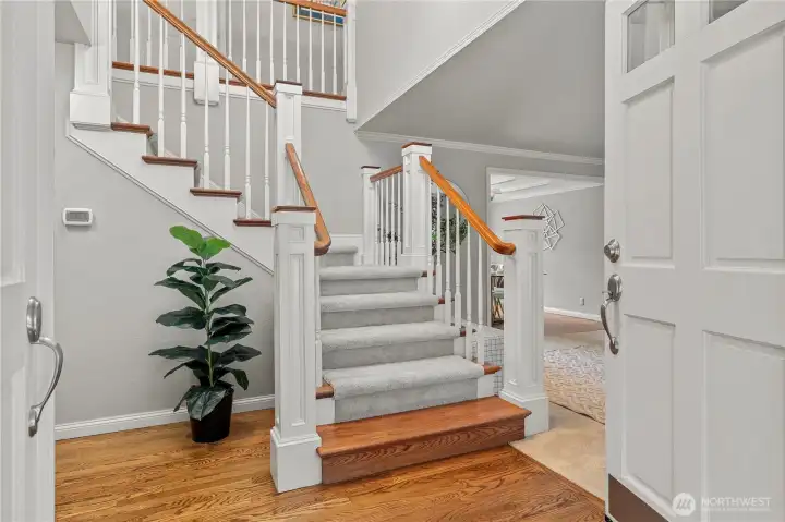 Beautiful Craftsman Box Newel Staircase and Gleaming Hardwood Flooring.