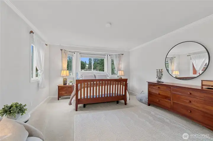 Unwind in the Spacious Primary Suite with plenty of room for a reading chair/Private lounging chair... including a bay window and walk-in closet—your private retreat at the end of the day.