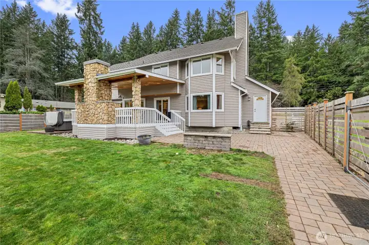 Private, expansive level backyard—perfect for large gatherings—showcasing exceptional outdoor living space just steps from the barn!